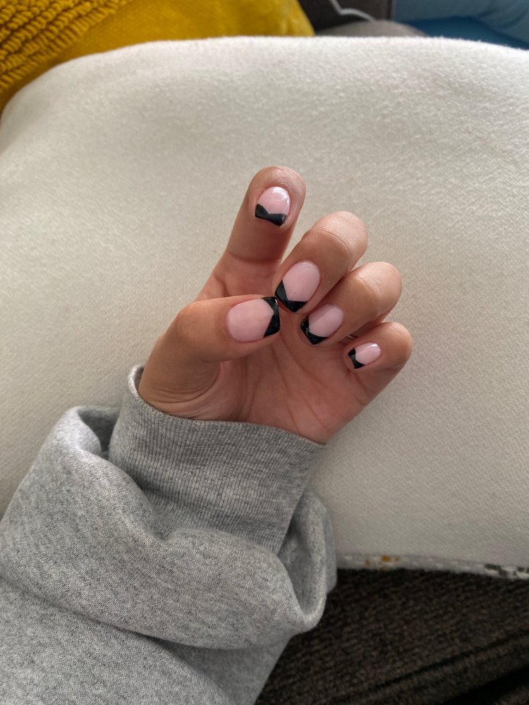 Black French manicure on hand
