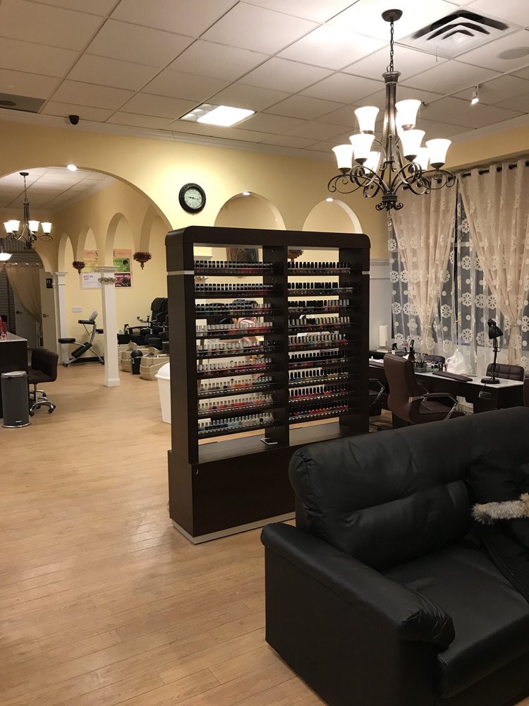 Ithaca E Nail Spa interior with polish displays and pedicure chairs